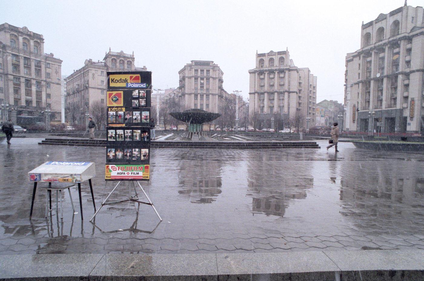 Tourist photographer's display featuring Kodak and Polaroid in Independence Square, Kiev, 1995.