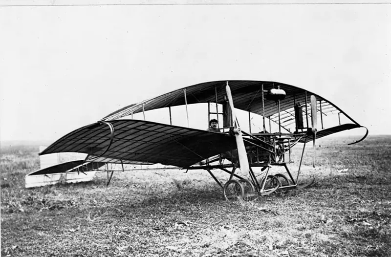 An experimental biplane with a pilot.