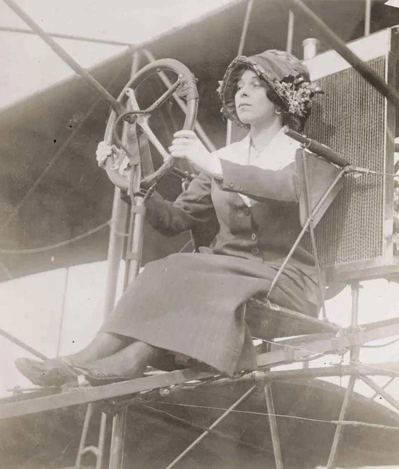 Early aviation pioneer Julia Clark behind the wheel of a plane.