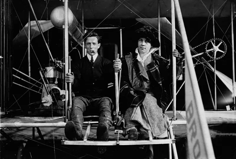 Pilot Harry Bingham Brown with Isabel Patterson in an early airplane.