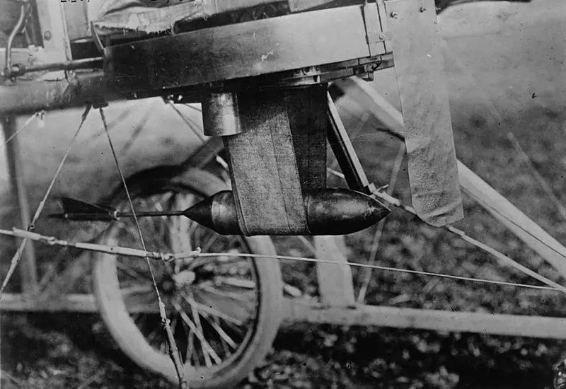 A small bomb on an early airplane.