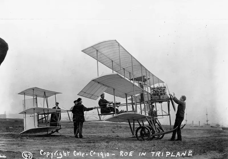 An early triplane with pilot and crew.