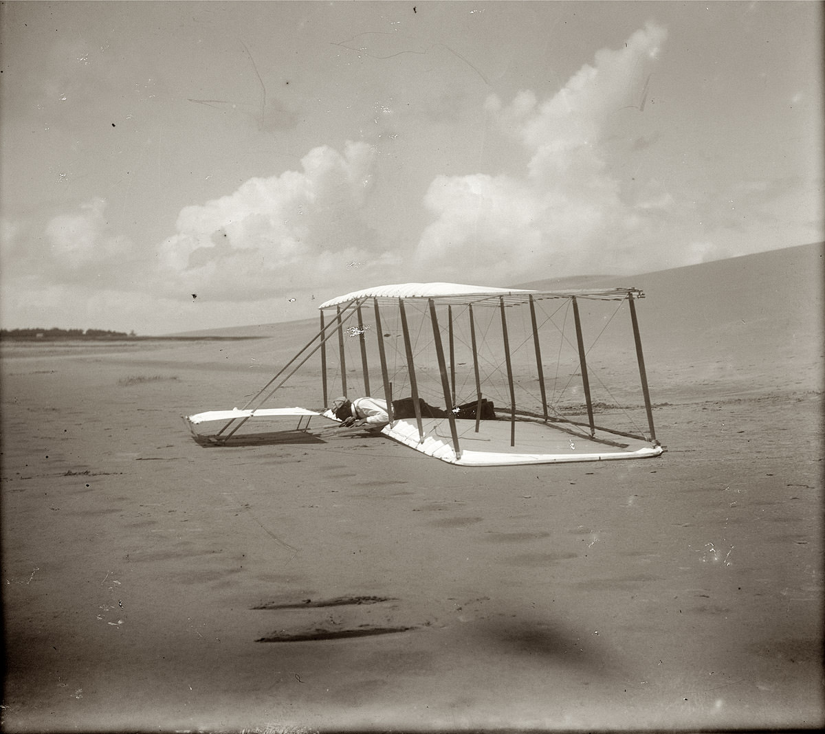 Kitty Hawk, North Carolina. Wilbur Wright and the glider just after landing, 1901.