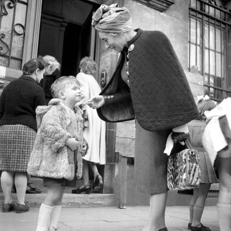 A little boy in Paris says goodbye to his mother outside a school in September 1945