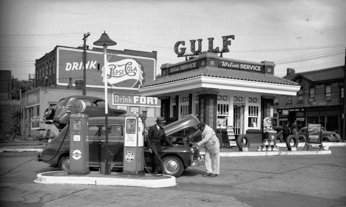 Mechanic and observer at Wilson Gulf service station in Pittsburgh, Pennsylvania, 1946.