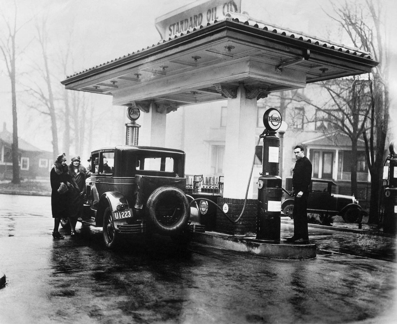 Car fueling up at a gas station in New Jersey, 1927.