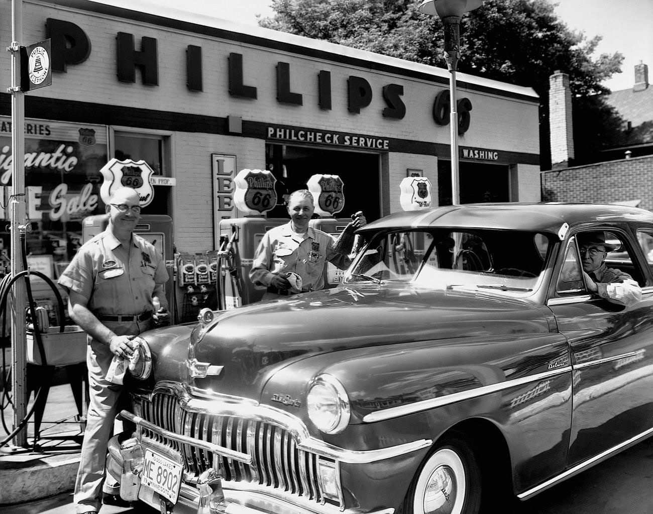 Attendants and Motorist at Phillips Service Station.