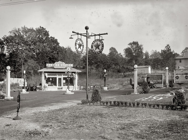 Spacious Texaco station with trees and full-service amenities, 1920s.