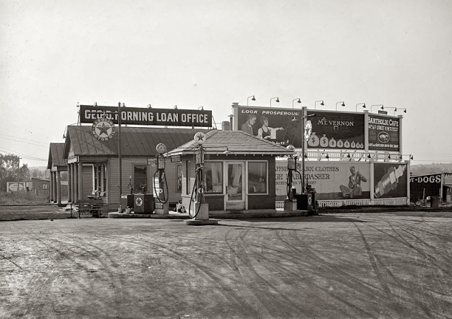 Early "mall" offering loans, meals, and auto services, 1920s.