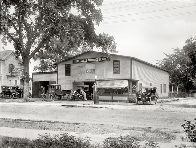 Ford Sales and Service featuring a fleet of Model T's, 1920s.