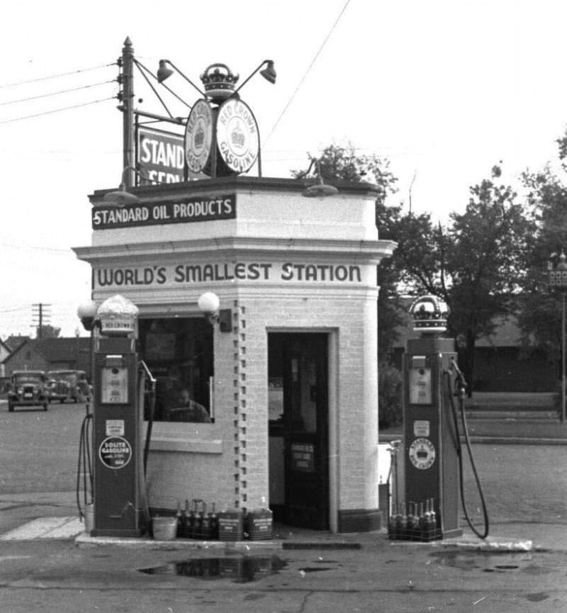 World's smallest gas station located in Detroit, 1930s.