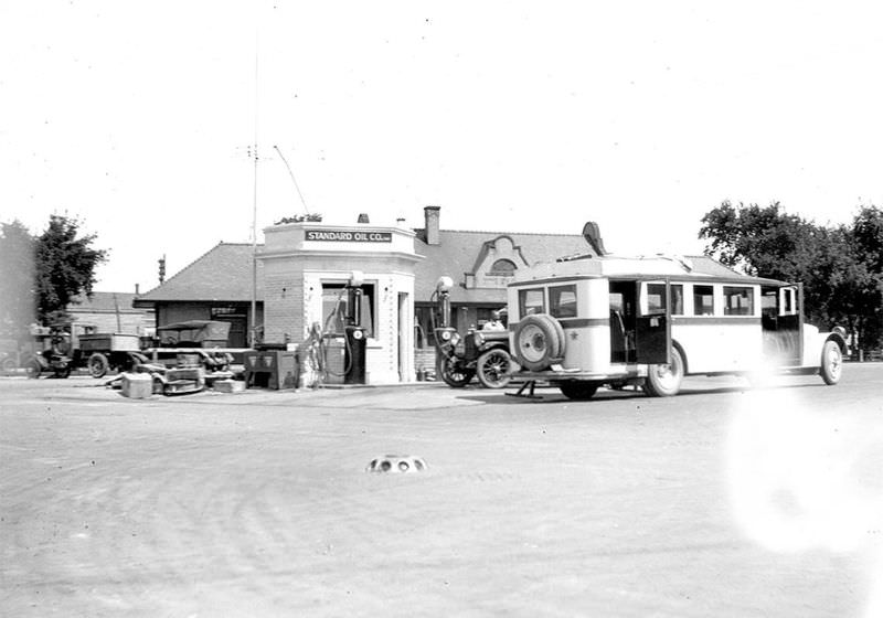 Smallest gas station next to the bus stop in downtown Detroit Lakes, 1930s.