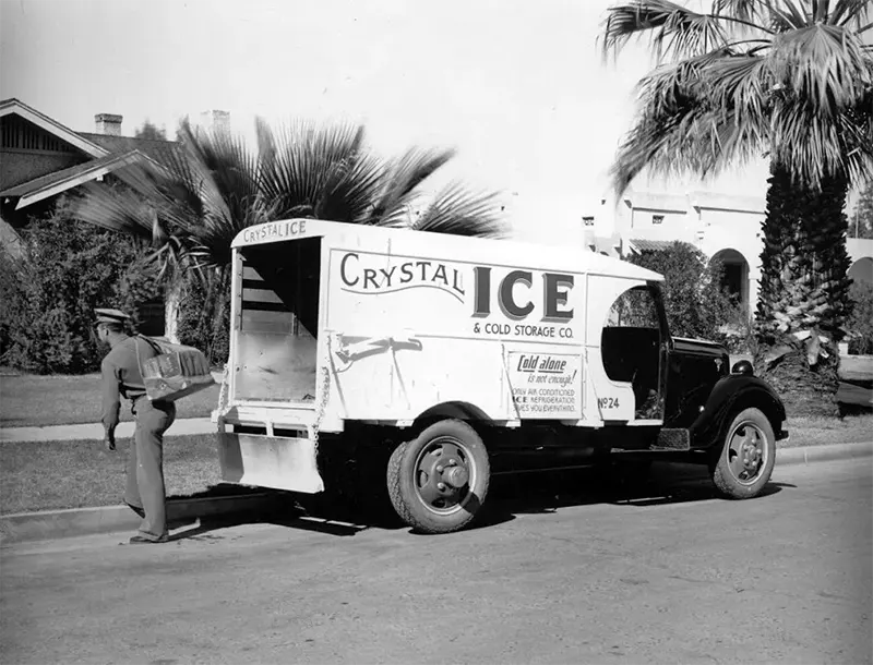 1940s Crystal Ice delivery truck in Phoenix, AZ. Typically the floor of the truck would be littered with ice chips. This iceman appears to be using something similar to a log carrier rather than the big tongs I saw being used in Oklahoma City.
