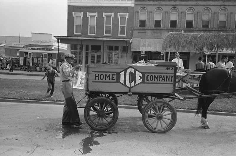 Iceman and ice-wagon in Crowley, Louisiana, 1938.