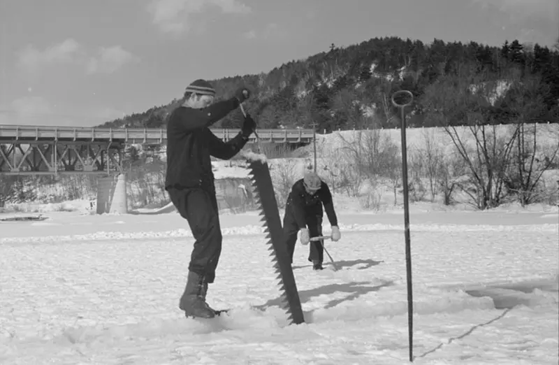 A photograph that captures the ice cutting process on the Ottauquechee River in 1936.