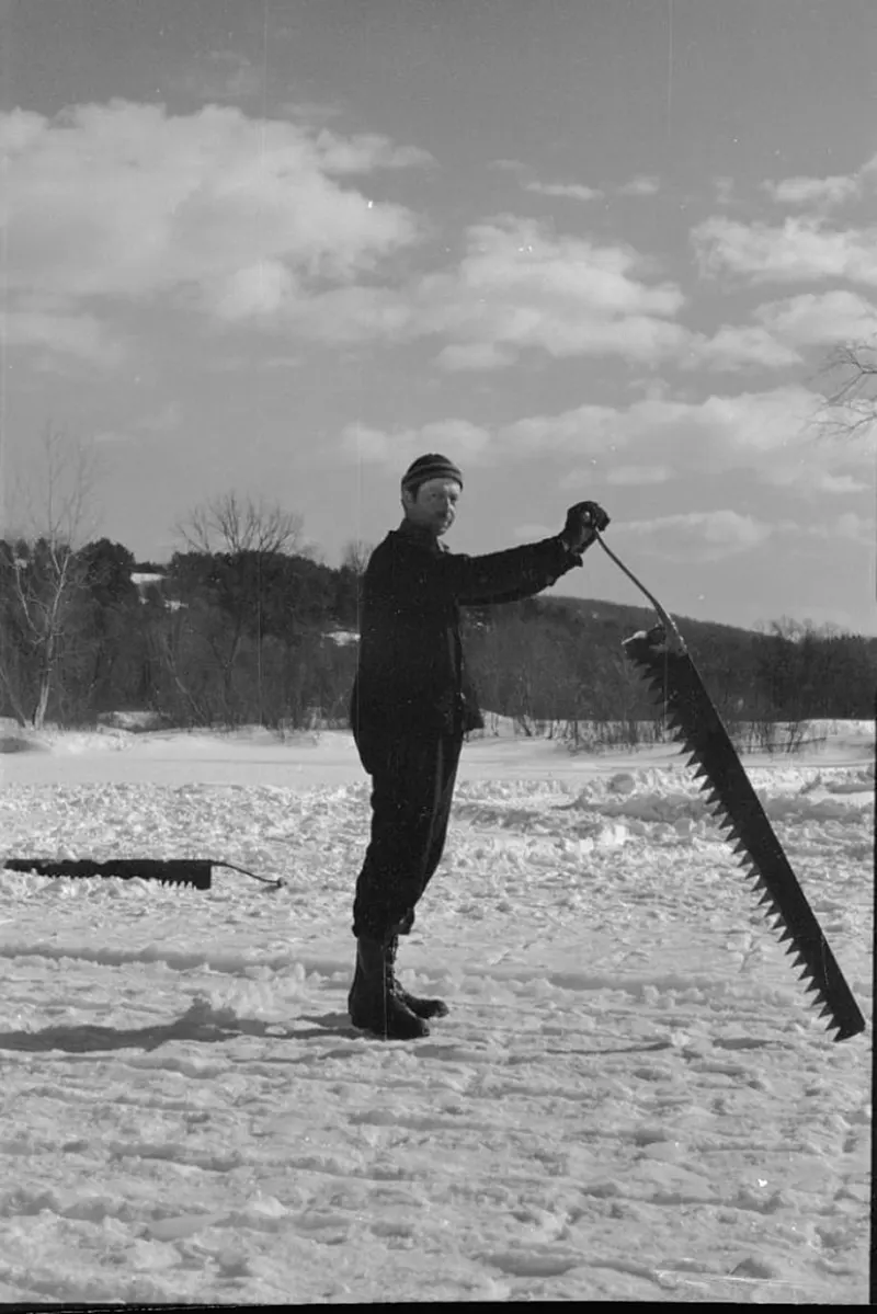 A photograph that captures the ice cutting process on the Ottauquechee River in 1936.