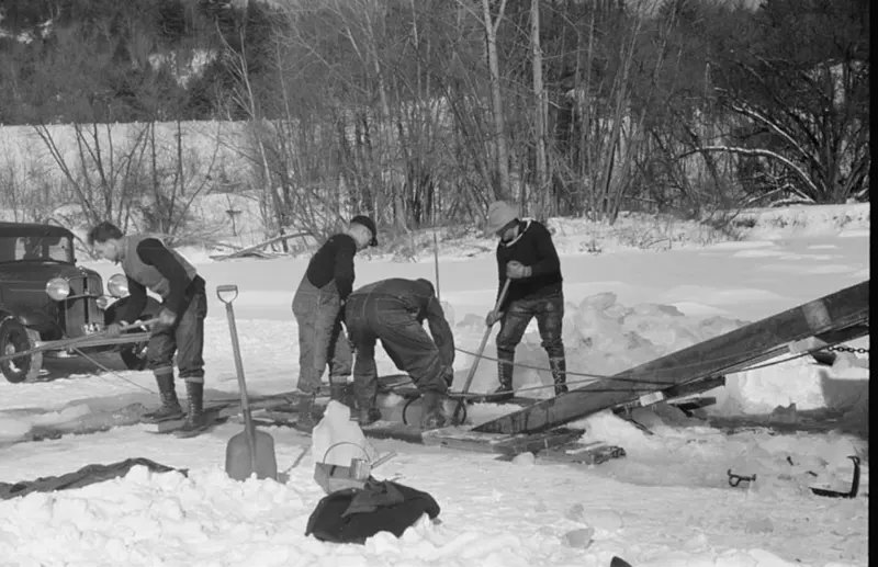 A photograph that captures the ice cutting process on the Ottauquechee River in 1936.