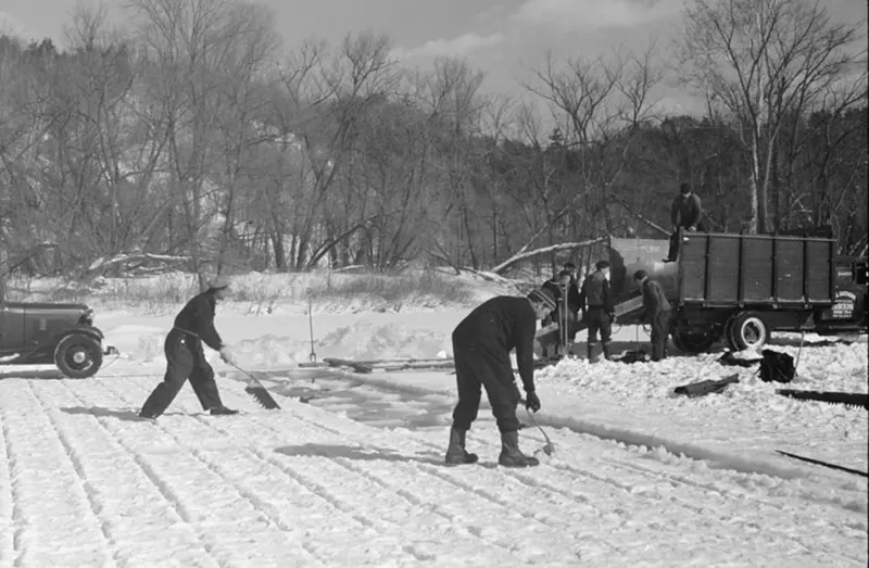 A photograph that captures the ice cutting process on the Ottauquechee River in 1936.