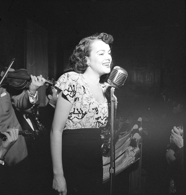 A vocalist with Justin Stone’s ensemble, between 1938 and 1948. (Photo by William P. Gottlieb)