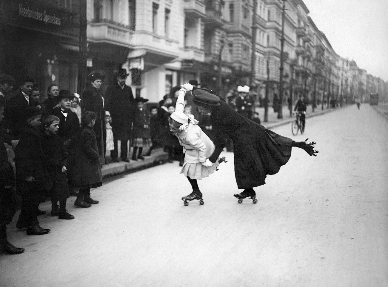 A Woman and Girl Pair-Skating on Berlin Streets, 1910.