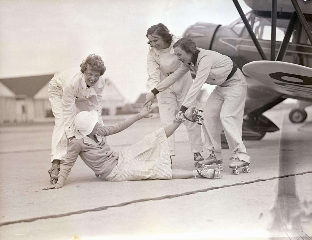Amelia Earhart and Aviatrices Help a Fallen Skater, 1933.
