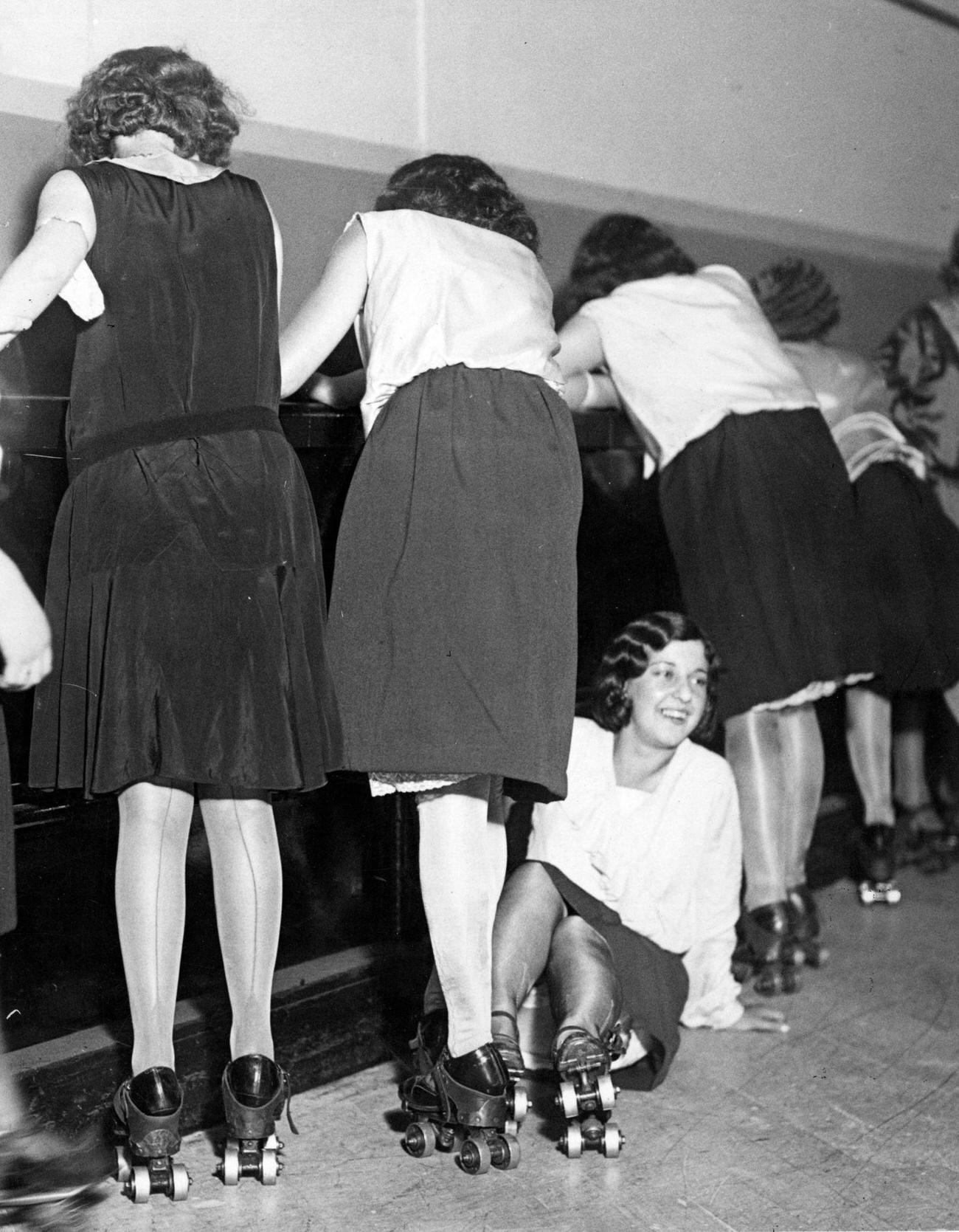 Group of Skaters Clinging to Sides, One Falling, circa 1935.