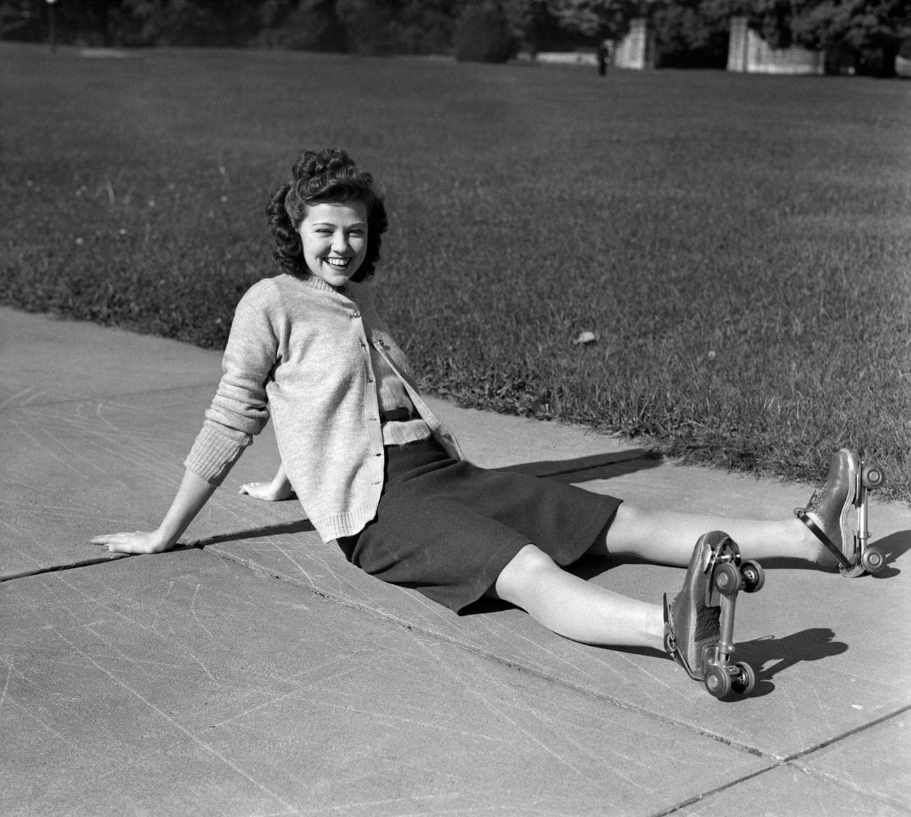 Laughing Young Woman Sitting After a Fall, 1940s.