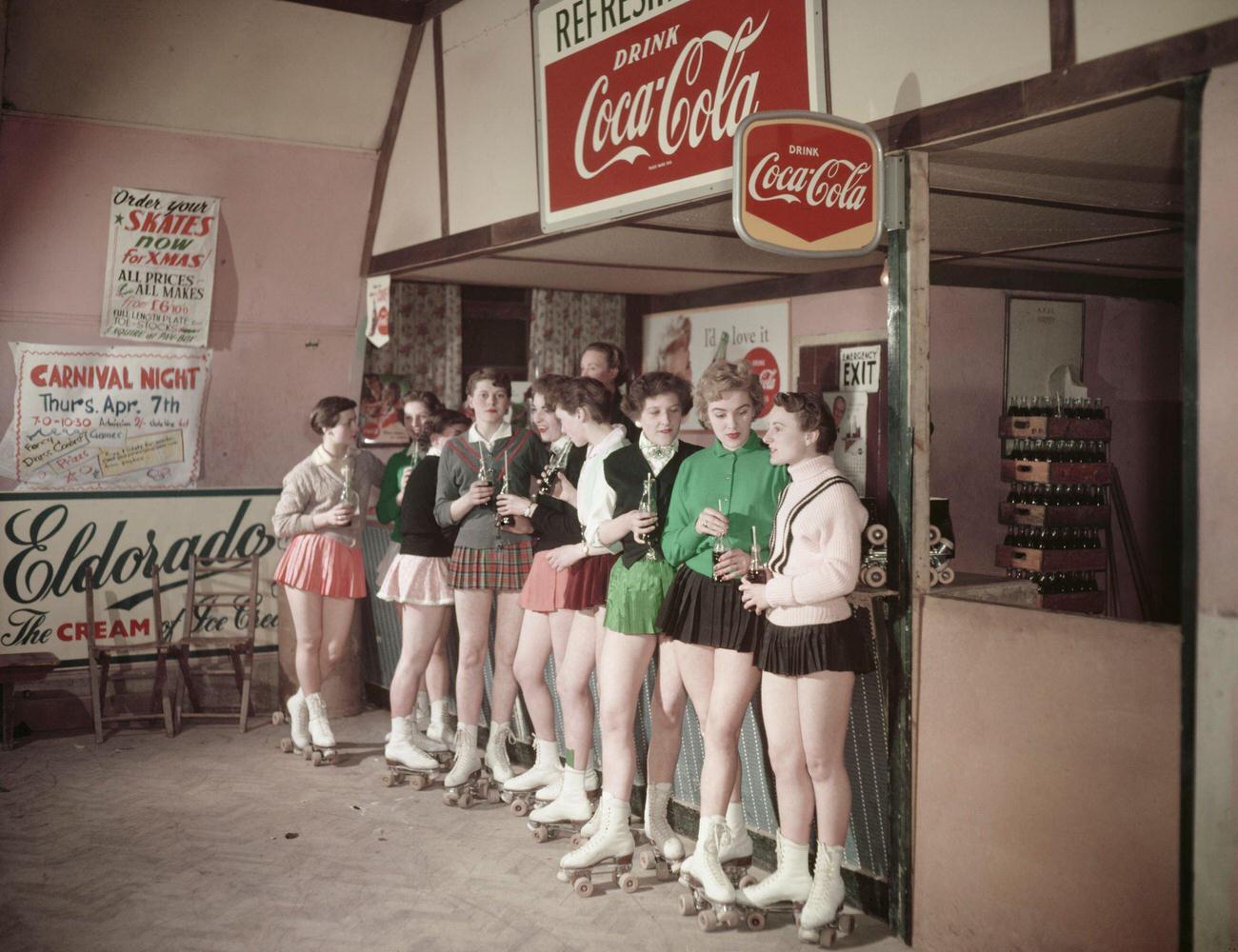 Young Women Enjoy Coca-Cola at Roller Skating Rink in Norwich, England, 1955