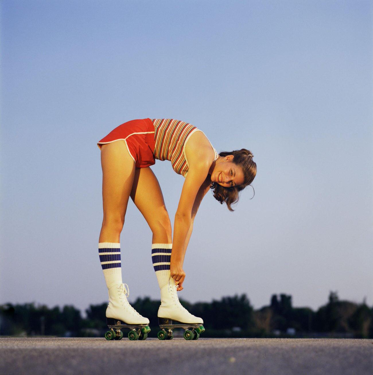Woman Tying Laces of Her Roller Skates