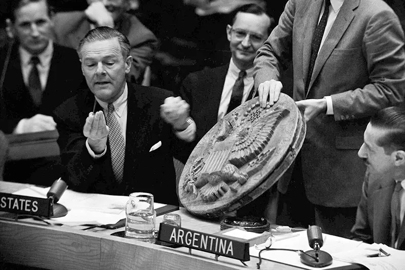 Henry Cabot Lodge displays the bug in front of the United Nations.