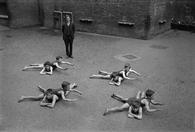 Children Learning Swimming Techniques Without Water, 1922