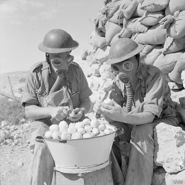 Soldiers Use Gas Masks for Onion Peeling, 1941
