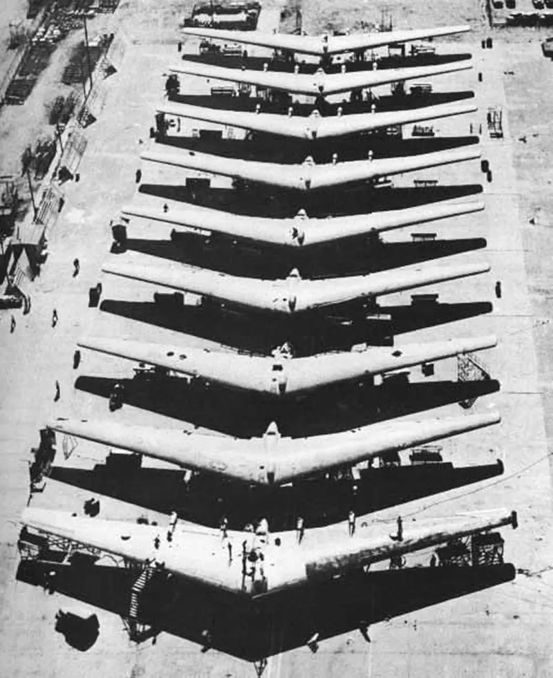 This is a rare photo of nine Northrop Flying Wing Bombers. Many people do not realize that more than one or two prototypes were built of this design. Here, for the first time, is actual proof of their existence. Two of the big wing bombers are undergoing modifications from XB-35’s to Flying Wing B-49 1t Bombers.