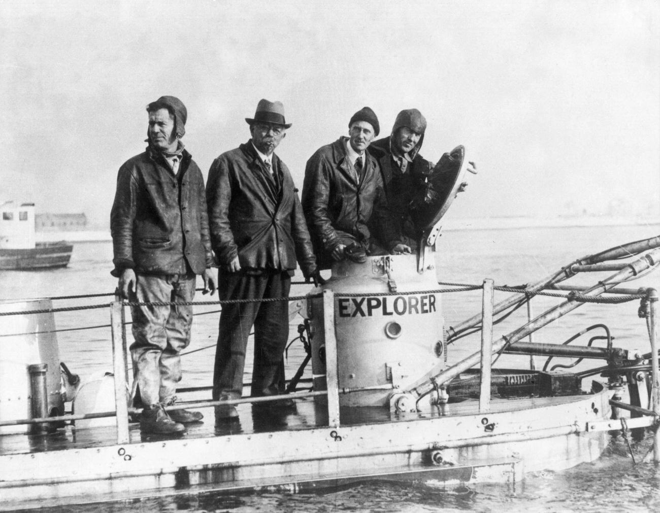 American Navy diver Frank Crilley, Simon Lake, William Beebe, and Jack Dunbar on deck of Lake's Explorer submarine, Long Island Sound, 1932.