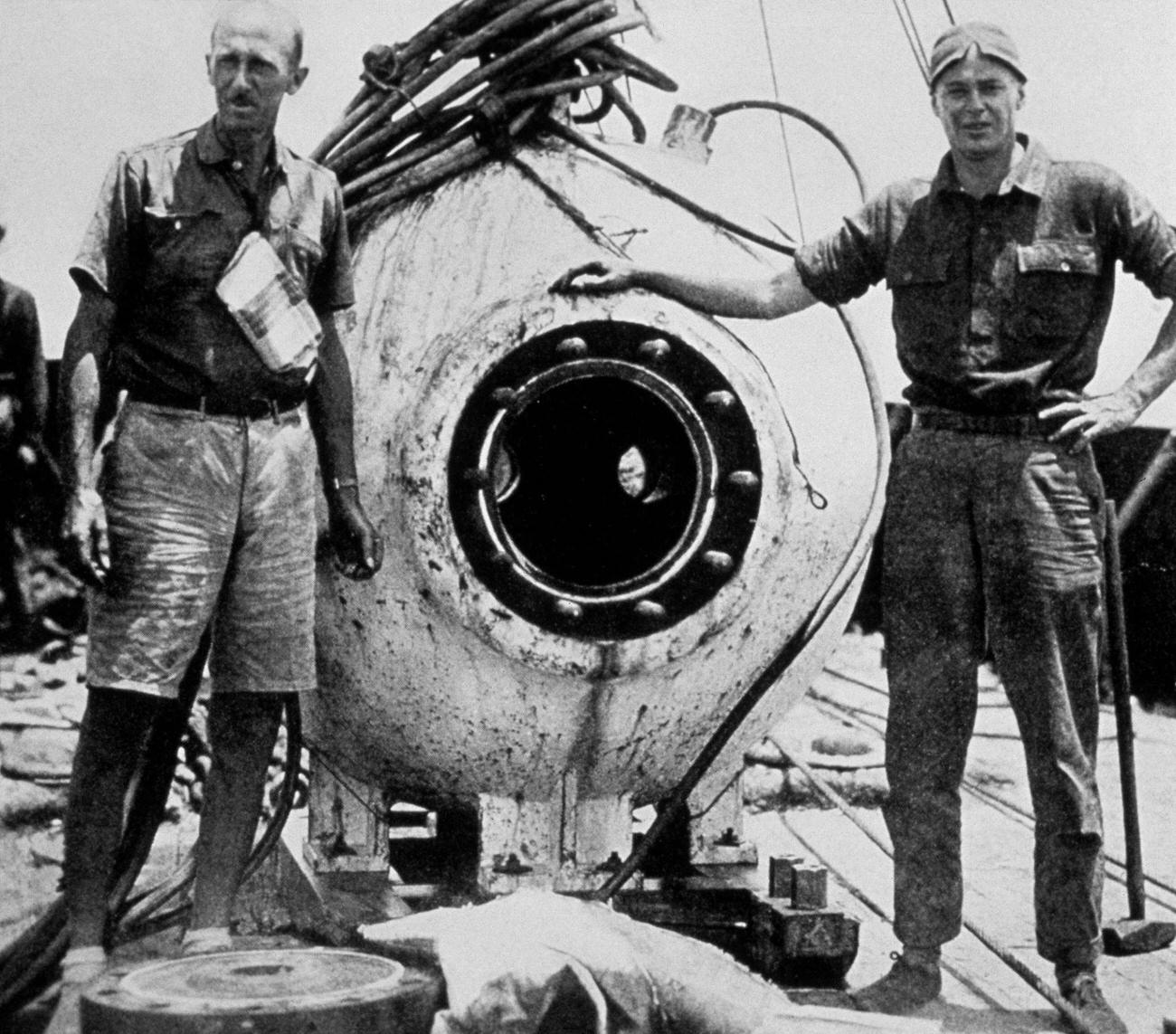 Marine biologist William Beebe and engineer Otis Barton with their bathysphere, Bermuda, circa 1934.