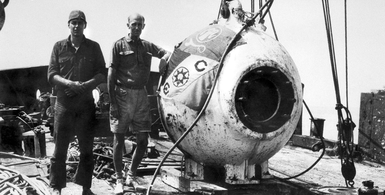 Inventors Otis Barton and William Beebe with their bathysphere, Bermuda.