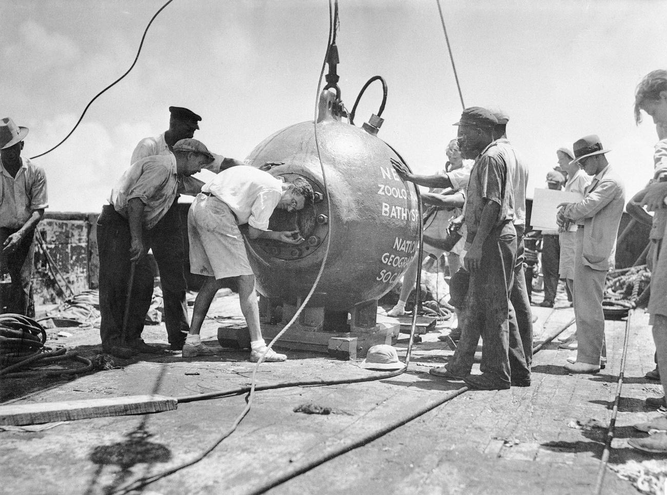 John Teevan opening the bathysphere used by William Beebe, Nonsuch Island, Bermuda, August 15th.