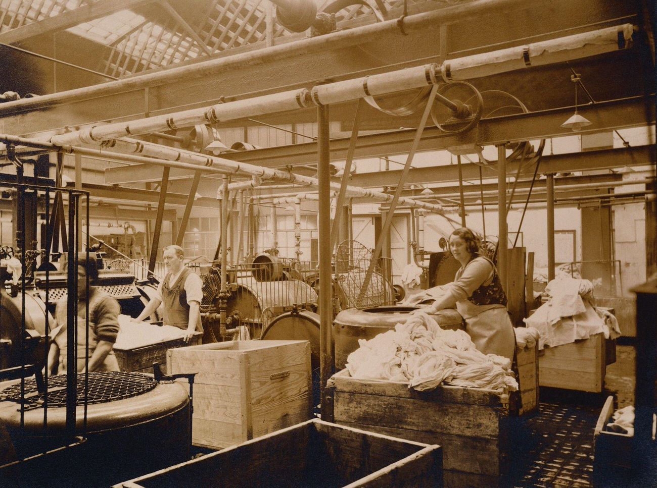 Men and women washing and pressing laundry in Bath, England.