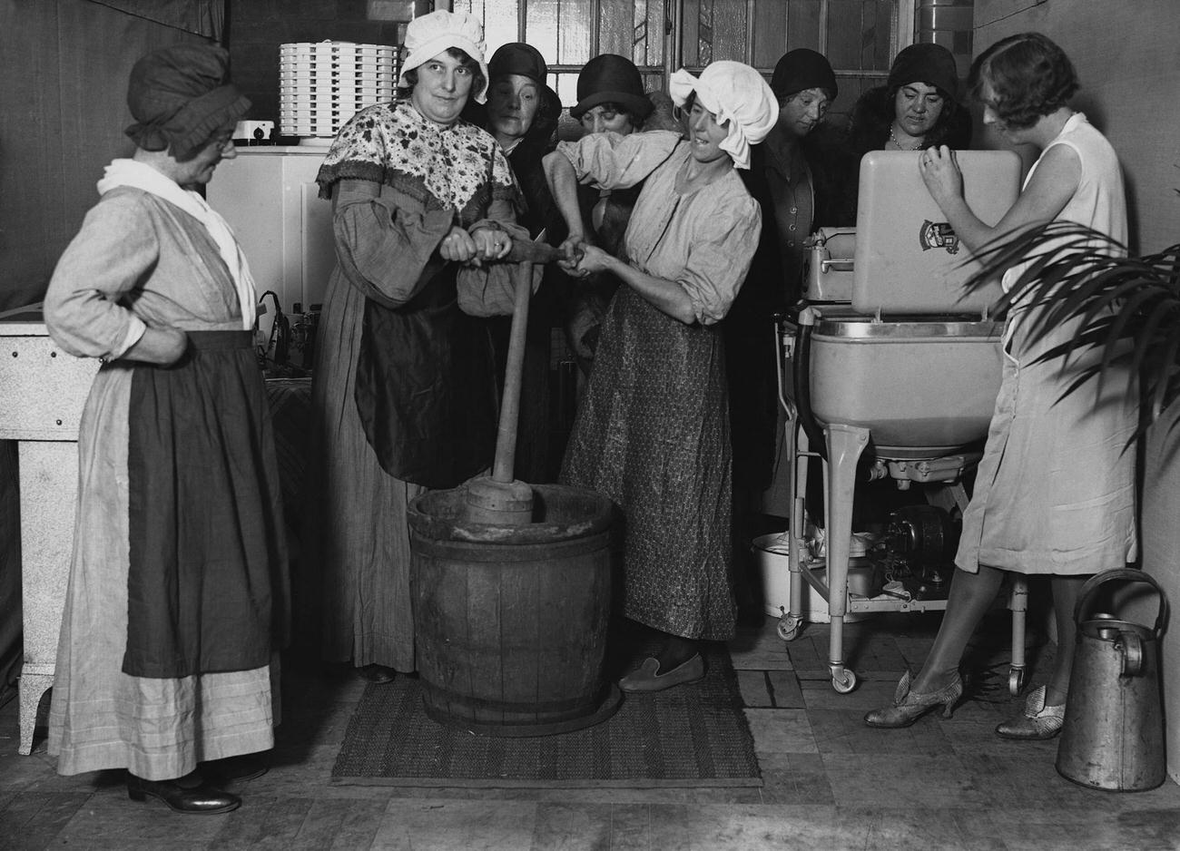Women demonstrating various laundering methods.