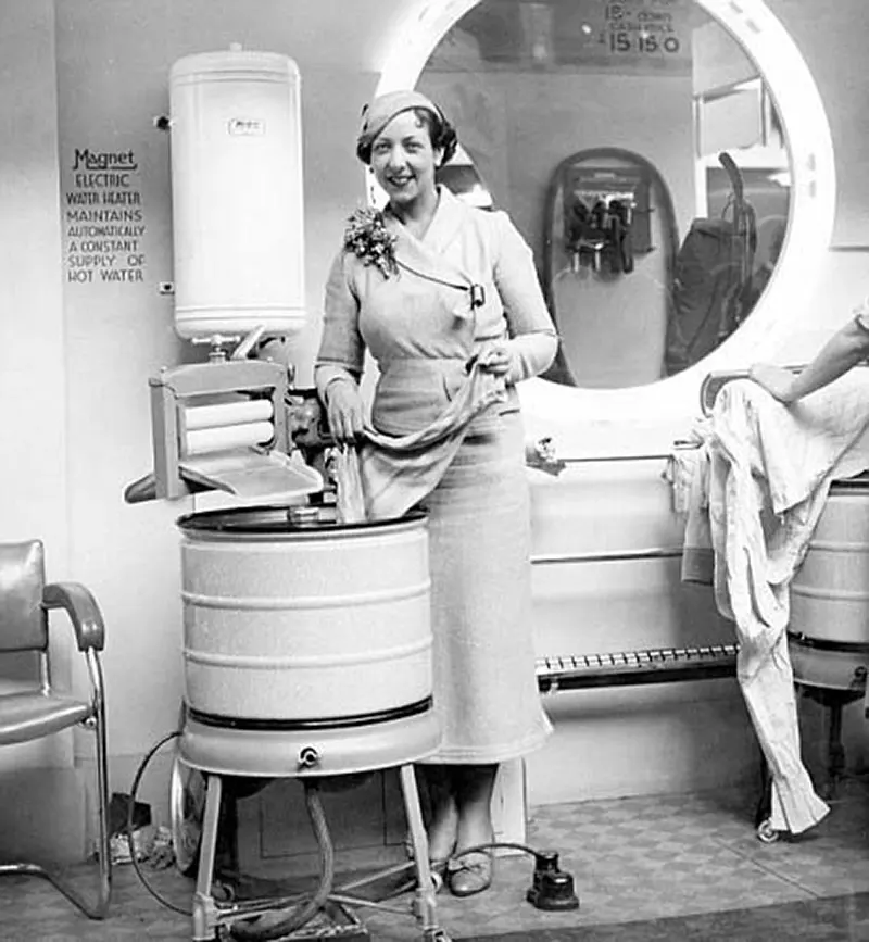 Actress Eileen Pollock with electric washing machine at 1935 Daily Mail Ideal Home Exhibition.