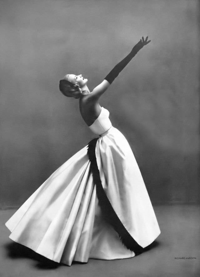 Sunny Harnett in Madeleine de Rauch's white satin gown, Harper's Bazaar UK, December 1954.