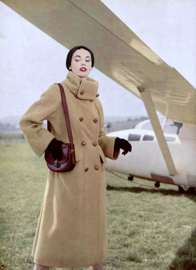 Joan Whelan in Madeleine de Rauch's camel-hair coat and Hermès accessories, 1952.