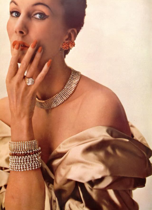 Barbara Goalen in Jacqmar stole and Adrian Mann jewelry, Harper's Bazaar UK, December 1951.