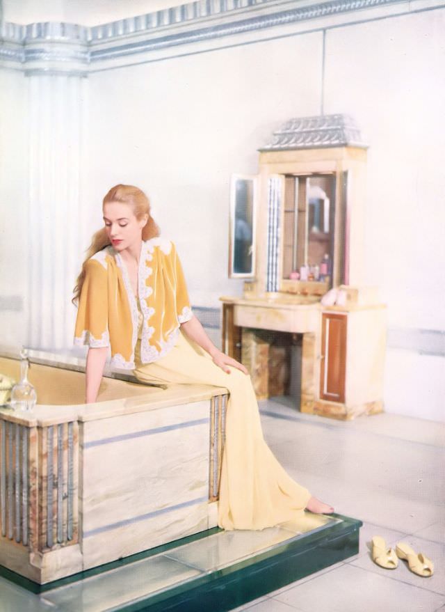 Model in Debenham & Freebody's velvet bed jacket, Harper's Bazaar UK, February 1951.