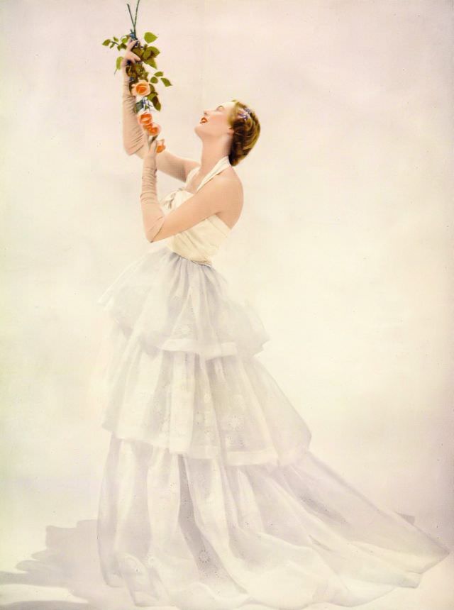 Model in Victor Stiebel's embroidered organdie dance dress, Harper's Bazaar UK, April 1951.