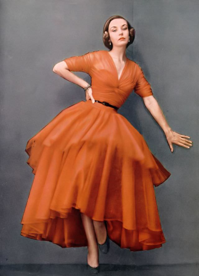 Shelagh Wilson in Victor Stiebel's flame tulle evening dress, Harper's Bazaar UK, 1951.