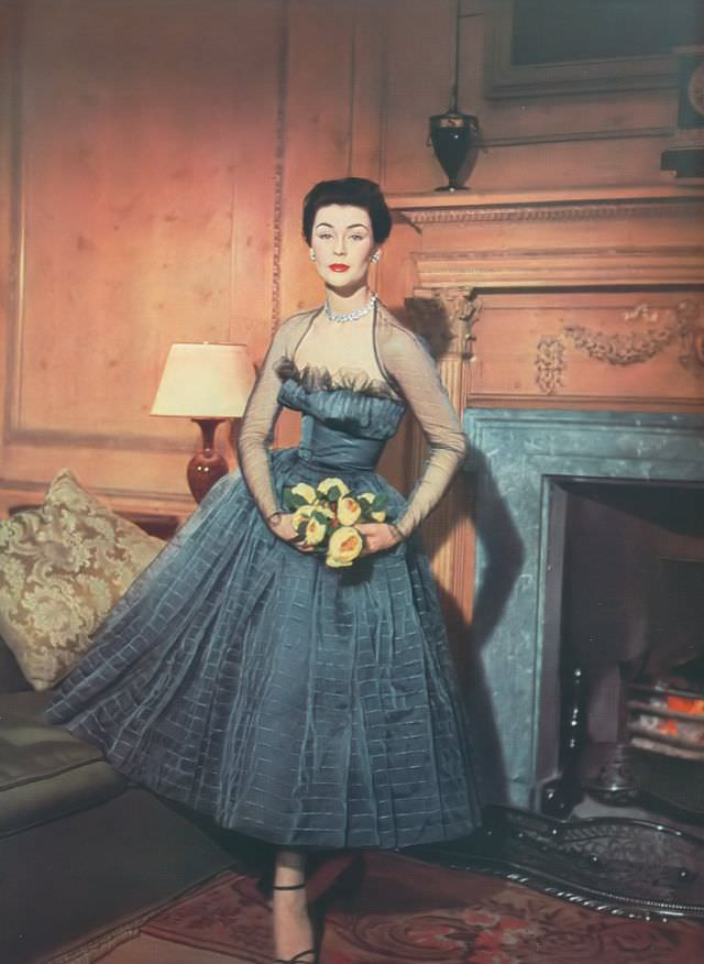 Anne Gunning in Hardy Amies' silk organza dress, Harper's Bazaar UK, April 1952.