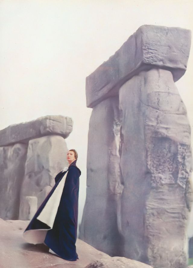 Barbara Goalen in Bradleys' amethyst velvet cape at Stonehenge, Harper's Bazaar UK, July 1952.