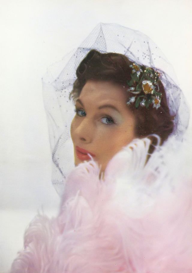 Barbara Goalen with 1810 diamond and ruby hairpiece, ostrich fan, 1950.