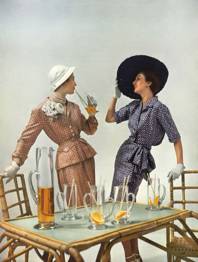 Pat O'Reilly and Barbara Goalen in Molyneux and Hardy Amies dresses, Harper's Bazaar UK, May 1950.